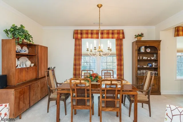 a dining room filled with furniture and window