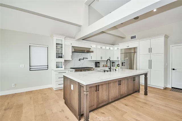 a dining room with furniture a chandelier and window