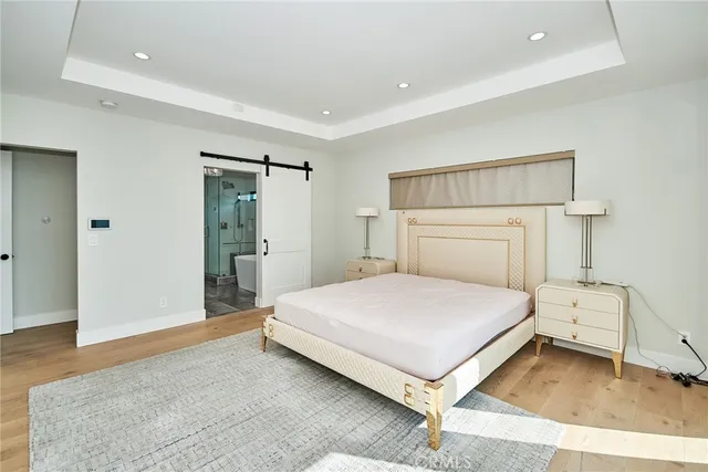 a view of a balcony with wooden floor and a view of mountains in the background