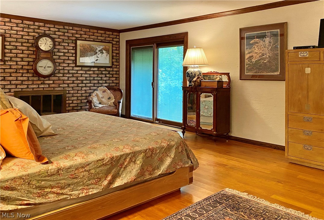 2222 Lancaster Road Akron, OH 44313 - Photo 19 of 35 First Floor Master Suite with brick fireplace surround and sliders to private patio.