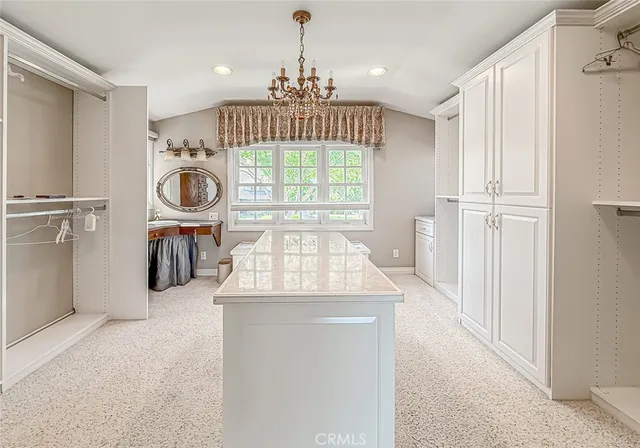a kitchen with a refrigerator and a sink