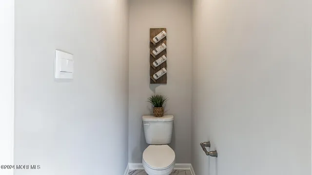 a bathroom with a toilet and a sink