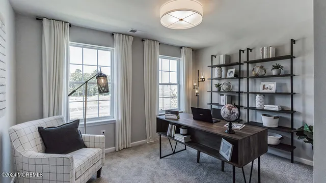a living room with furniture a rug and a large window