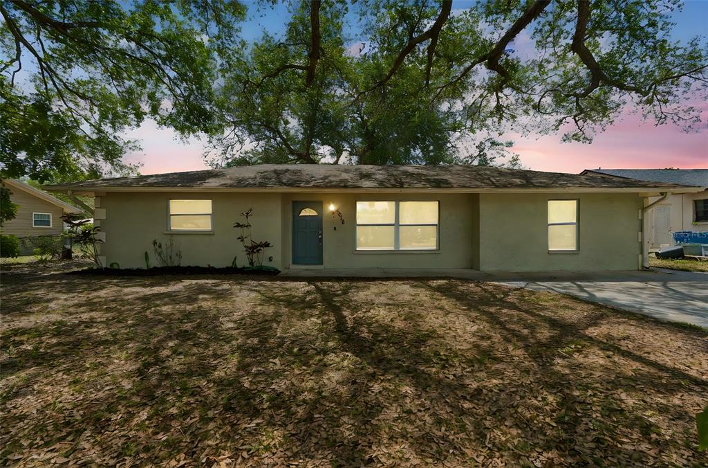 a house with trees in front of it