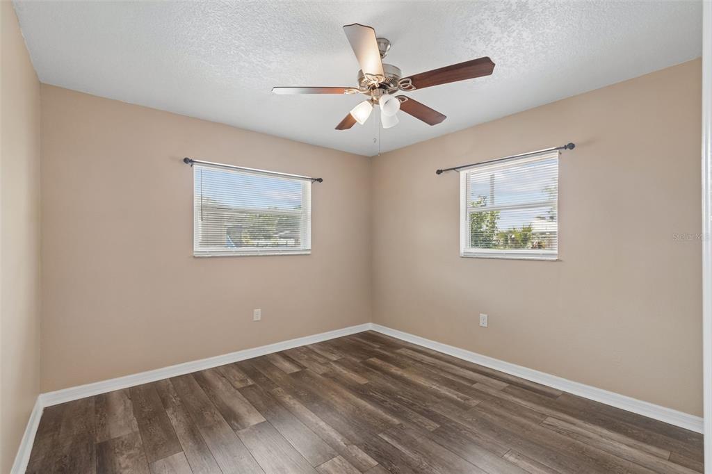 4018 Prado Drive Sarasota, FL 34235 - Photo 45 of 74 a view of an empty room with wooden floor