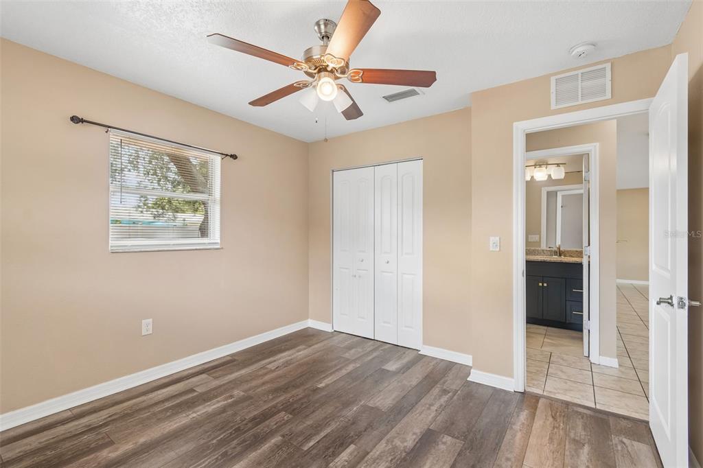 4018 Prado Drive Sarasota, FL 34235 - Photo 46 of 74 wooden floor in an empty room with a window