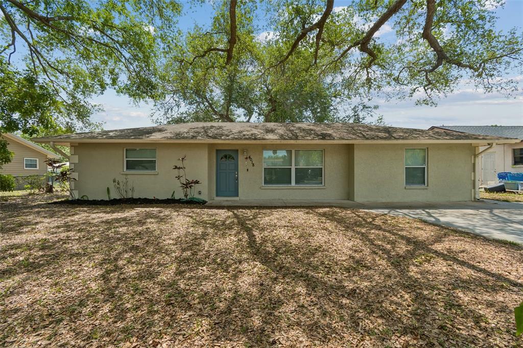 4018 Prado Drive Sarasota, FL 34235 - Photo 5 of 74 a house view with a garden space