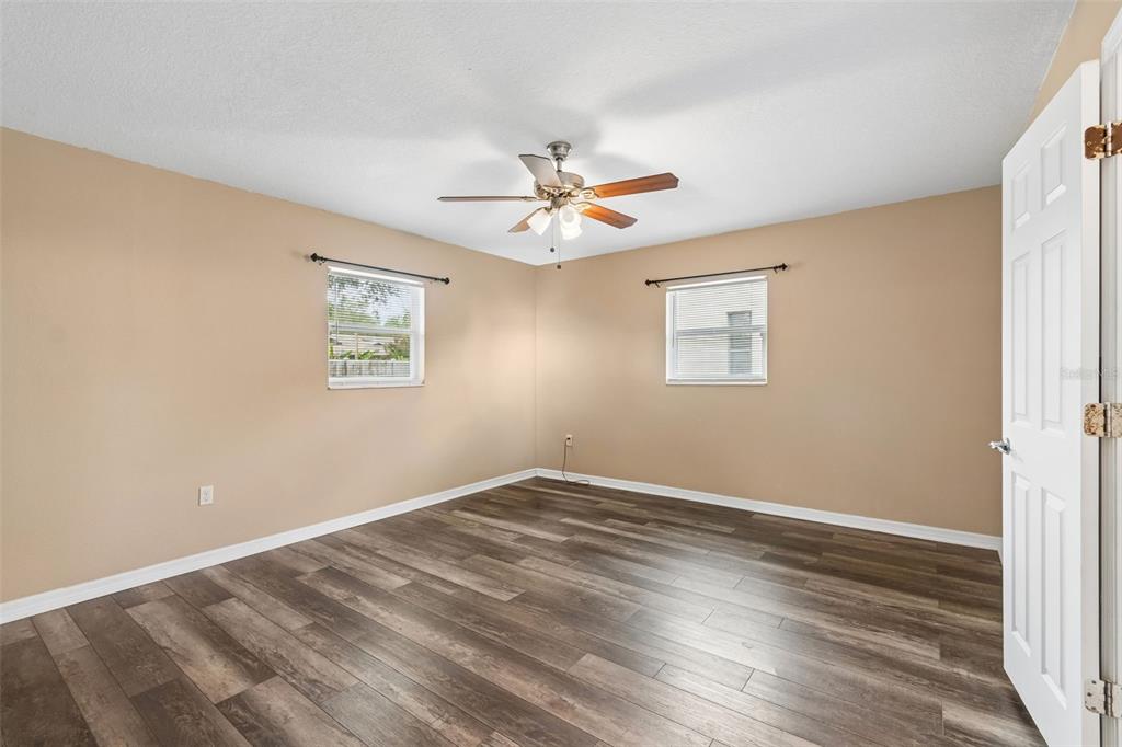 4018 Prado Drive Sarasota, FL 34235 - Photo 51 of 74 wooden floor in an empty room with a window