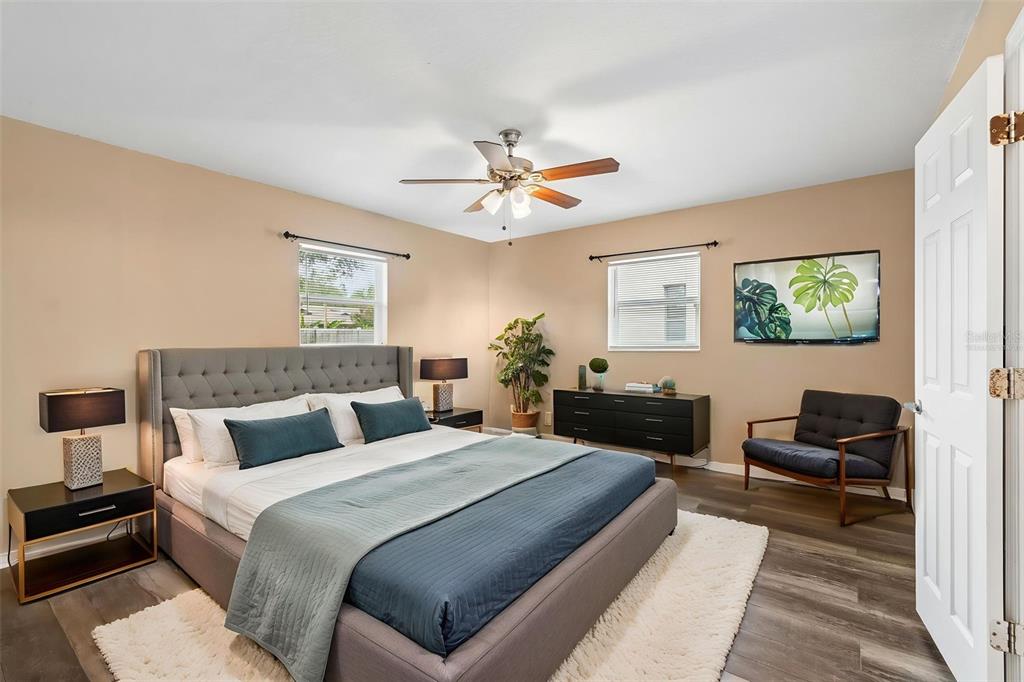 4018 Prado Drive Sarasota, FL 34235 - Photo 52 of 74 a bedroom with a bed and a couch