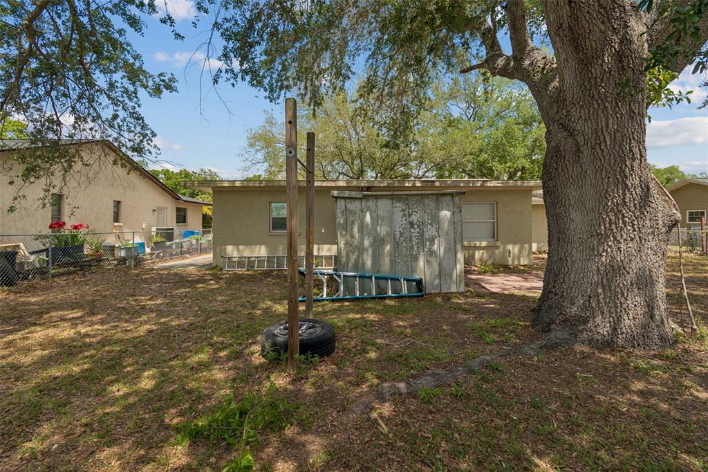 4018 Prado Drive Sarasota, FL 34235 - Photo 61 of 74 a view of a lake with a house in the background