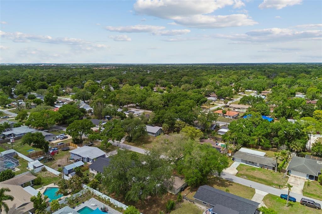 4018 Prado Drive Sarasota, FL 34235 - Photo 72 of 74 an aerial view of residential houses with outdoor space and trees