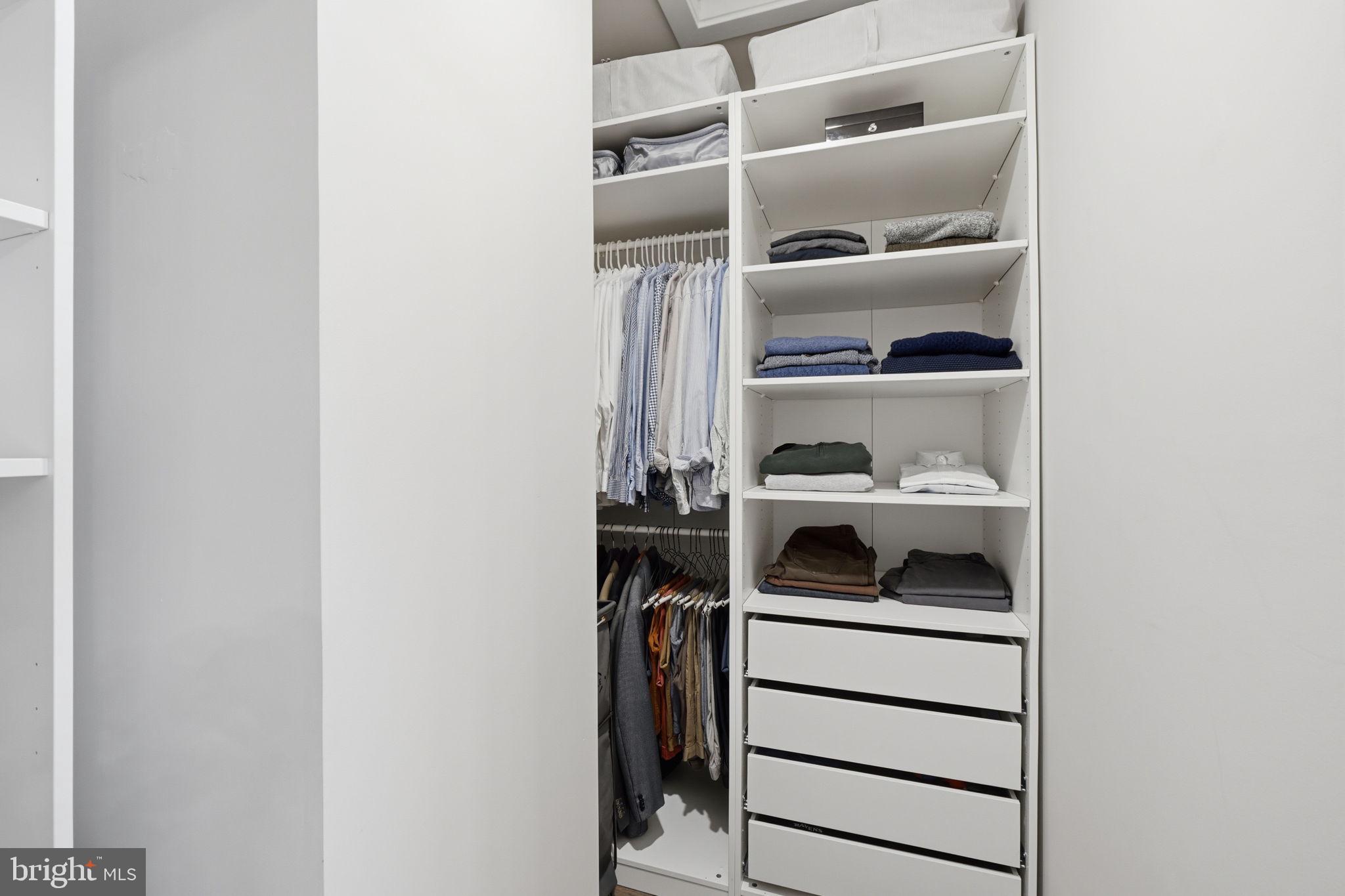 17812 Thomas Village Lane Sandy Spring, MD 20860 - Photo 21 of 37 a view of walk in closet with clothes and shoes