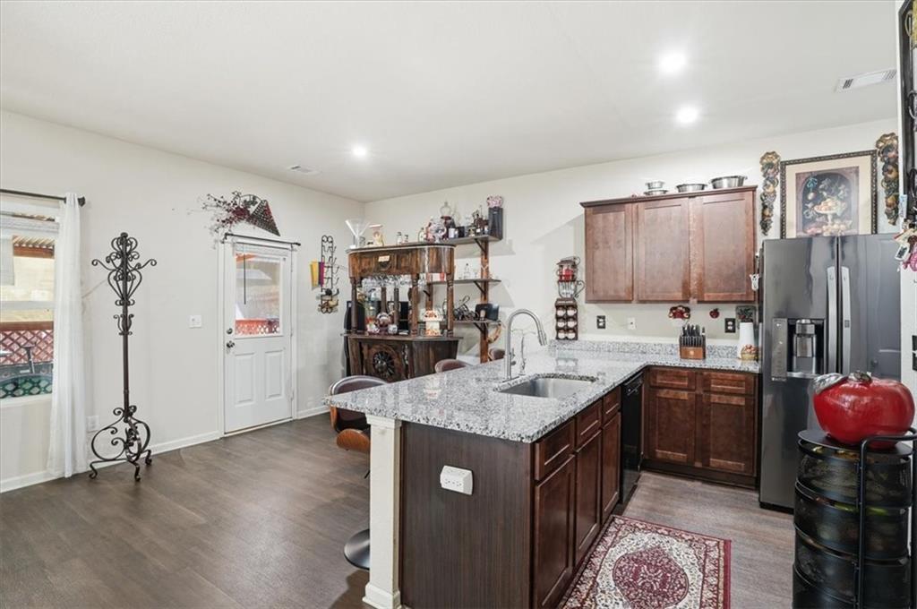 222 Seasons Valley Pendergrass, GA 30567 - Photo 11 of 30 a kitchen with stainless steel appliances granite countertop a sink stove and refrigerator