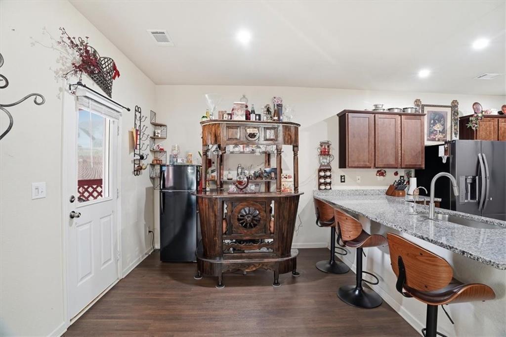 222 Seasons Valley Pendergrass, GA 30567 - Photo 12 of 30 a view of a kitchen with fridge and workspace