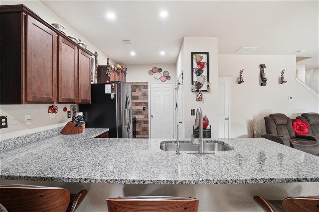 222 Seasons Valley Pendergrass, GA 30567 - Photo 13 of 30 a view of a kitchen counter top of kitchen and living room