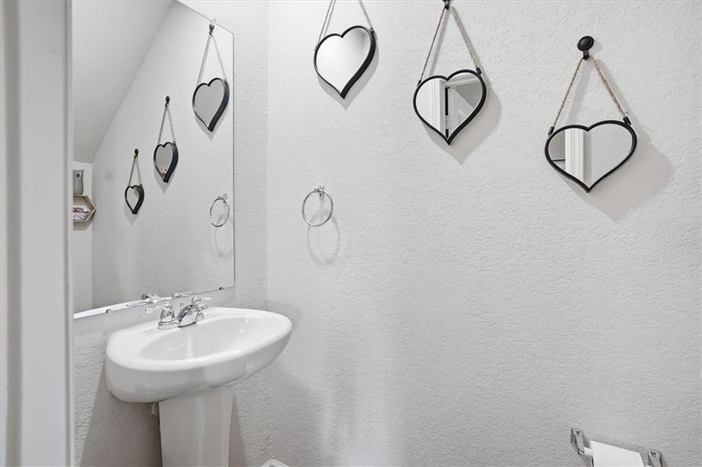 222 Seasons Valley Pendergrass, GA 30567 - Photo 16 of 30 a bathroom with a sink and mirror