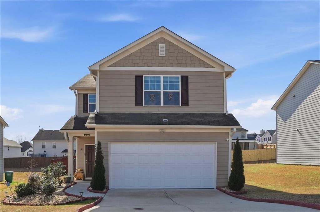 222 Seasons Valley Pendergrass, GA 30567 - Photo 2 of 30 a front view of a house with entertaining space