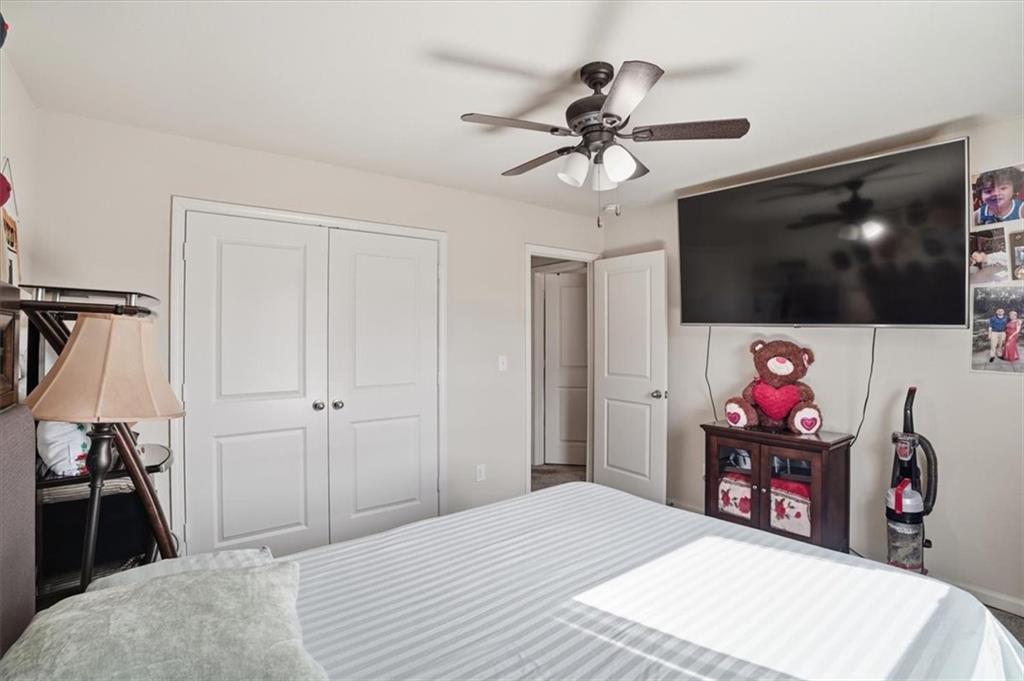 222 Seasons Valley Pendergrass, GA 30567 - Photo 21 of 30 a bedroom with a bed and a flat screen tv