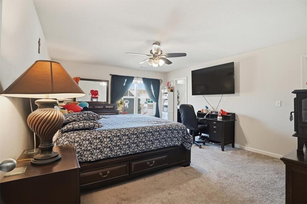 222 Seasons Valley Pendergrass, GA 30567 - Photo 23 of 30 a bedroom with bed and a flat screen tv