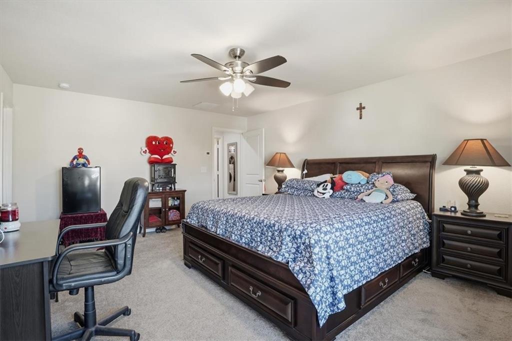 222 Seasons Valley Pendergrass, GA 30567 - Photo 25 of 30 a bedroom with a bed furniture and a chandelier