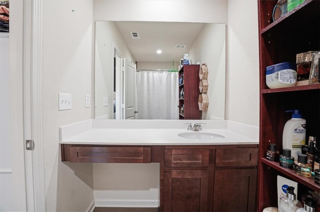 222 Seasons Valley Pendergrass, GA 30567 - Photo 27 of 30 a bathroom with a sink and a mirror
