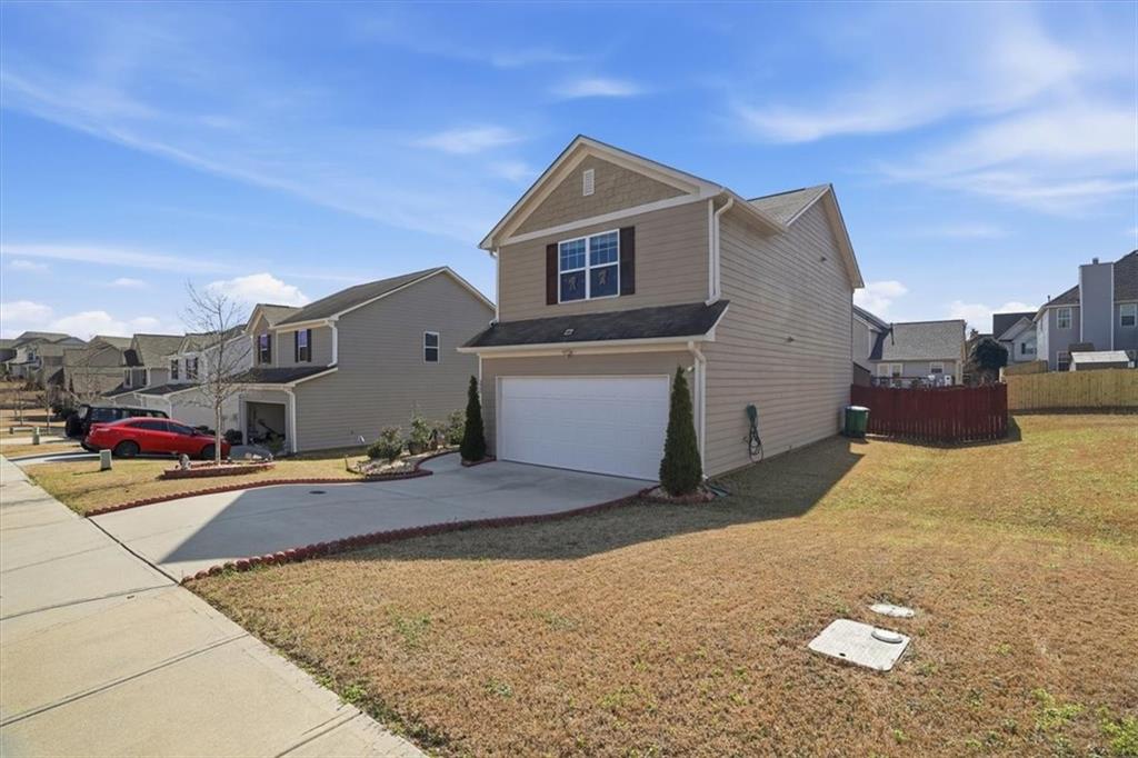 222 Seasons Valley Pendergrass, GA 30567 - Photo 3 of 30 a front view of a house with a yard