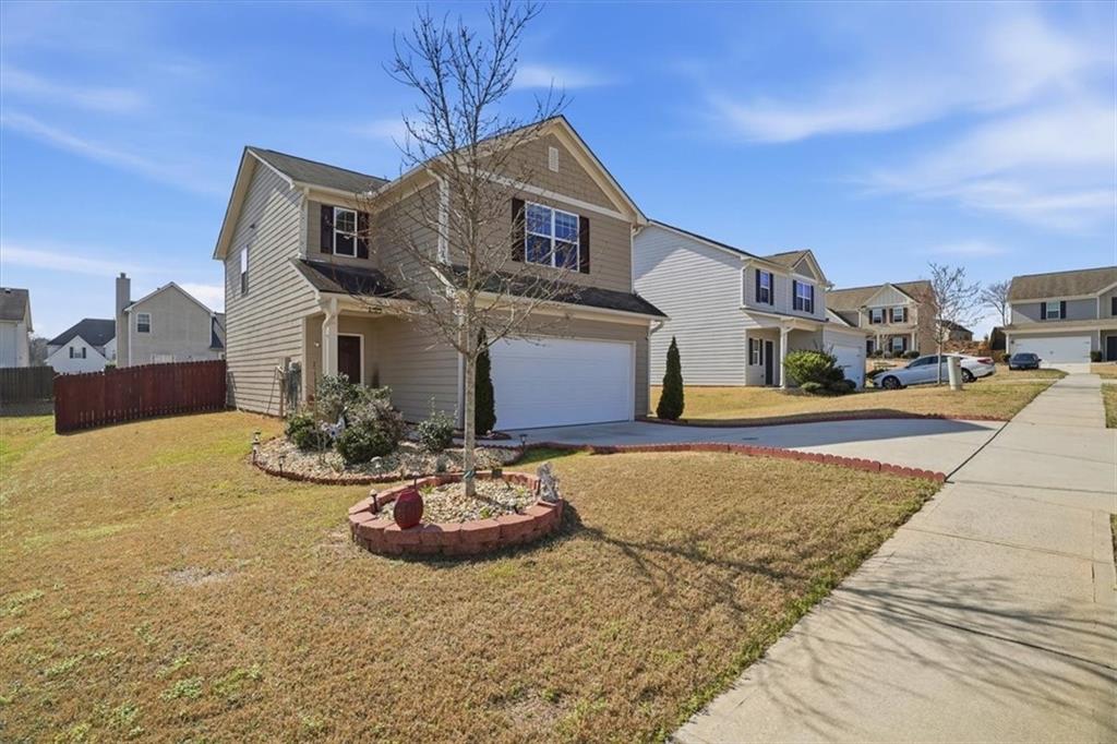 222 Seasons Valley Pendergrass, GA 30567 - Photo 4 of 30 a front view of a house with a yard