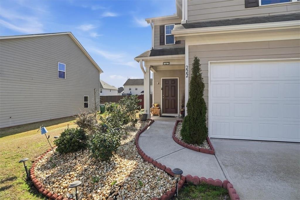 222 Seasons Valley Pendergrass, GA 30567 - Photo 5 of 30 front view of a house with a yard