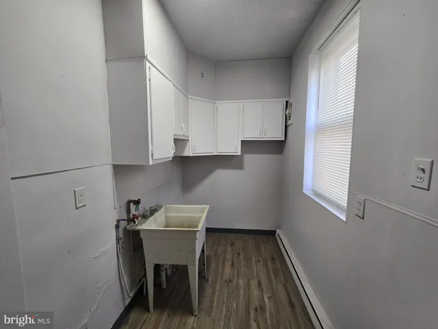 a room with wooden floor and chair