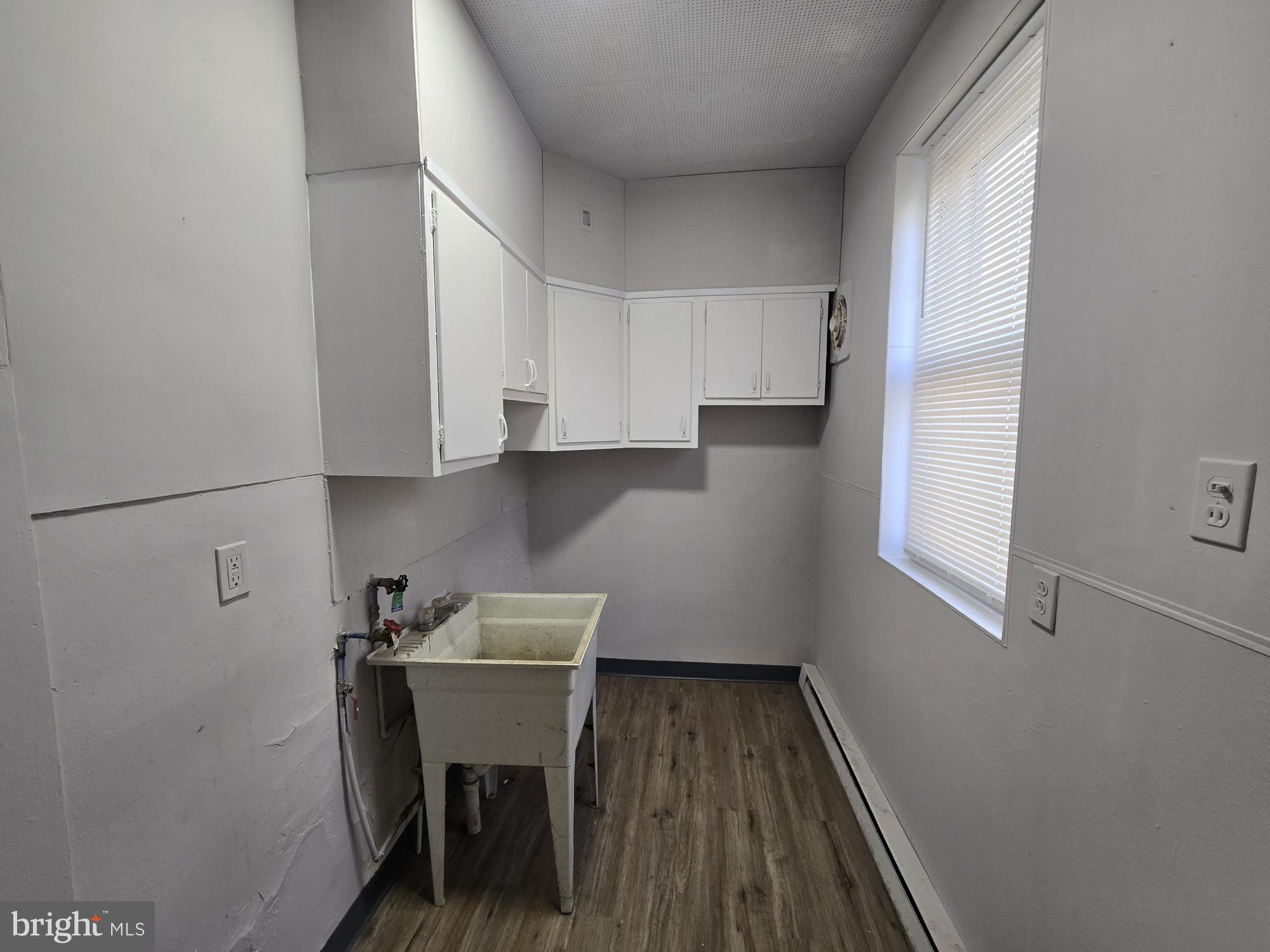 4254 North 7th Street Philadelphia, PA 19140 - Photo 11 of 26 a room with wooden floor and chair