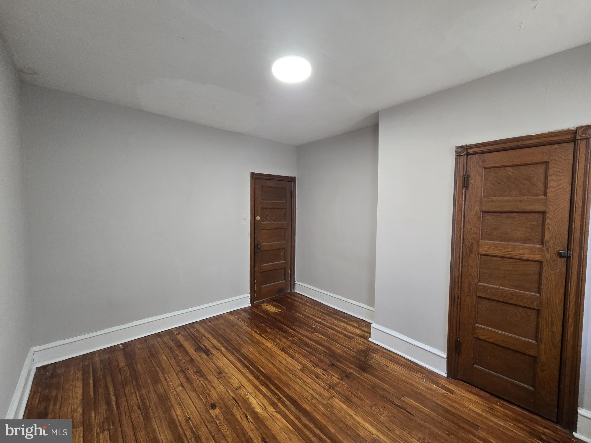 4254 North 7th Street Philadelphia, PA 19140 - Photo 20 of 26 wooden floor in an empty room