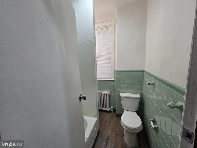 a bathroom with a toilet and a sink