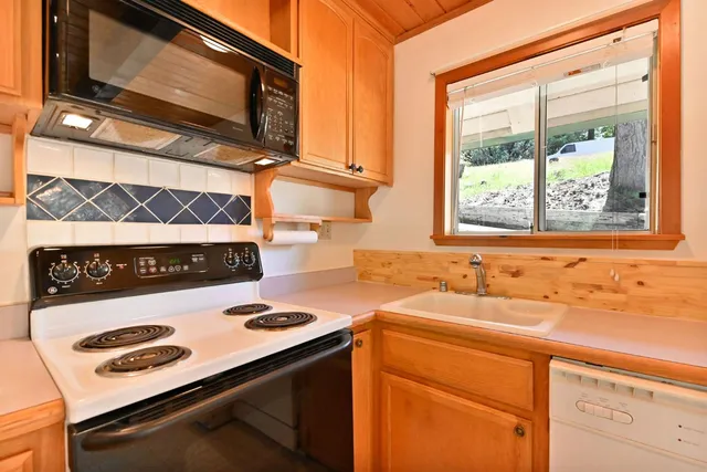 a kitchen with a stove and a microwave