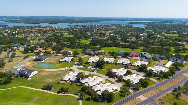 an aerial view of residential houses with outdoor space