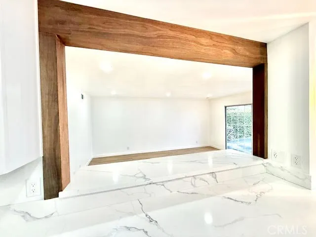 a kitchen with a sink and large window