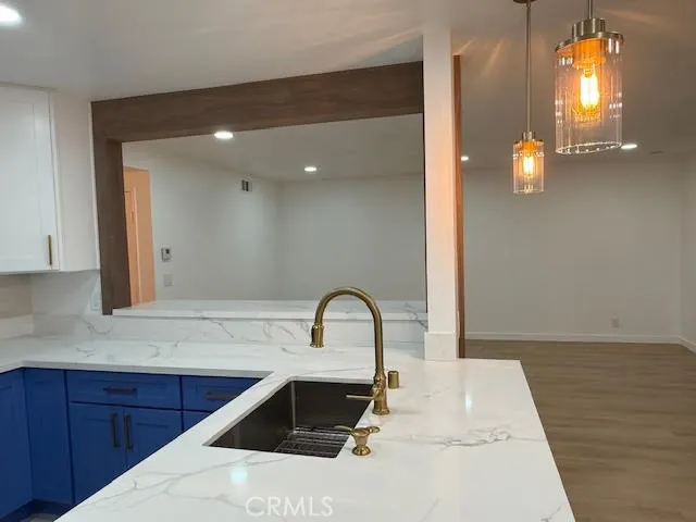a kitchen with wooden cabinets and a stove top oven
