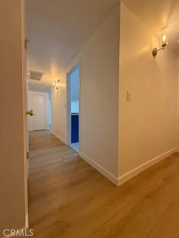 a view of a big room with windows