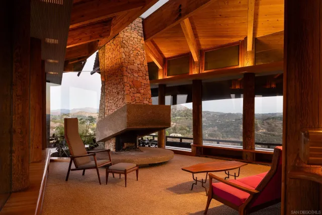 a view of a patio with table and chairs potted plants