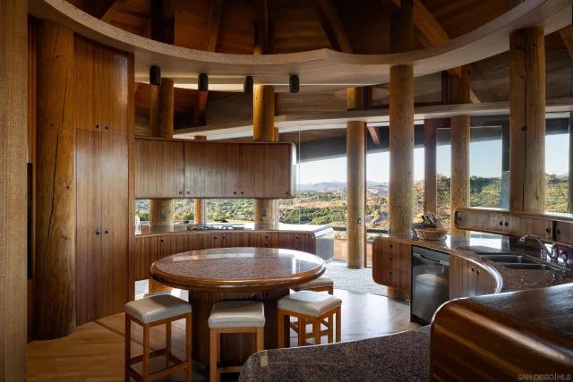 a view of a livingroom with furniture and a large window