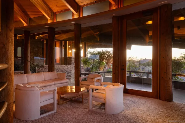 a dining room with furniture and window