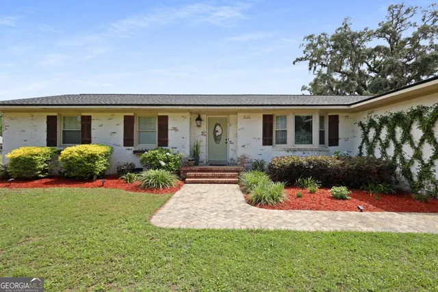 front view of a house with a yard