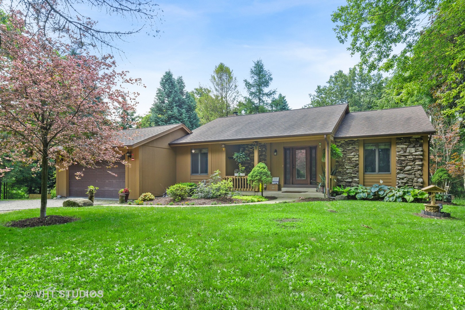 9N483 Muirhead Road Elgin, IL 60124 - Photo 1 of 40 a front view of a house with a garden and trees