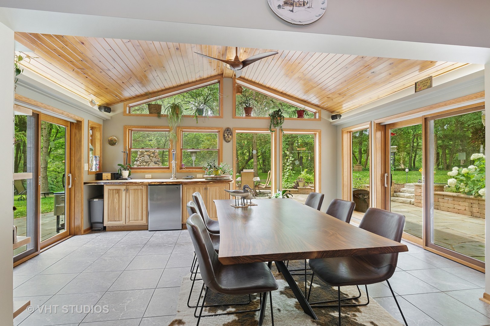 9N483 Muirhead Road Elgin, IL 60124 - Photo 13 of 40 a view of a dining room with furniture large windows and wooden floor