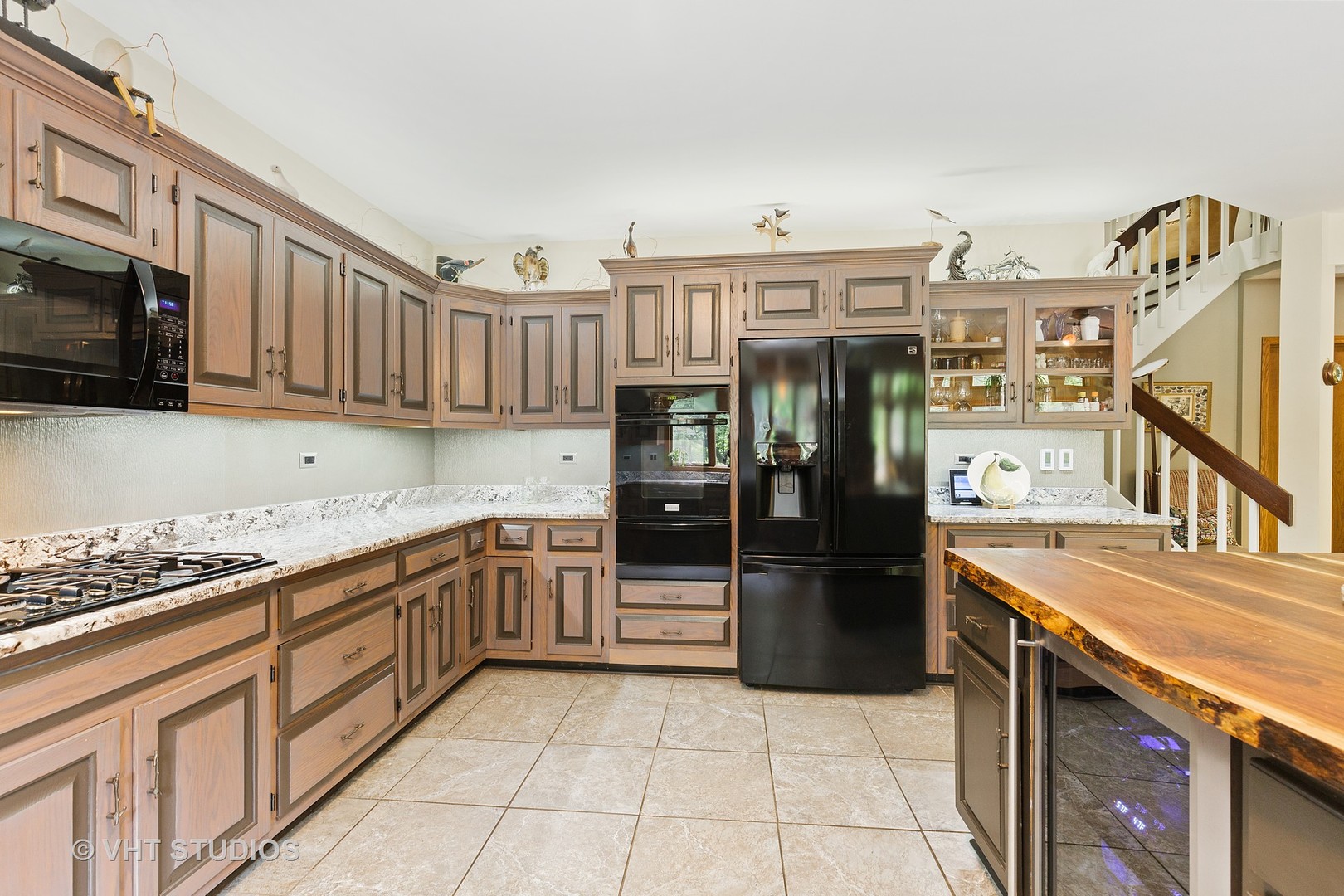 9N483 Muirhead Road Elgin, IL 60124 - Photo 17 of 40 a kitchen with stainless steel appliances granite countertop a refrigerator and a stove top oven