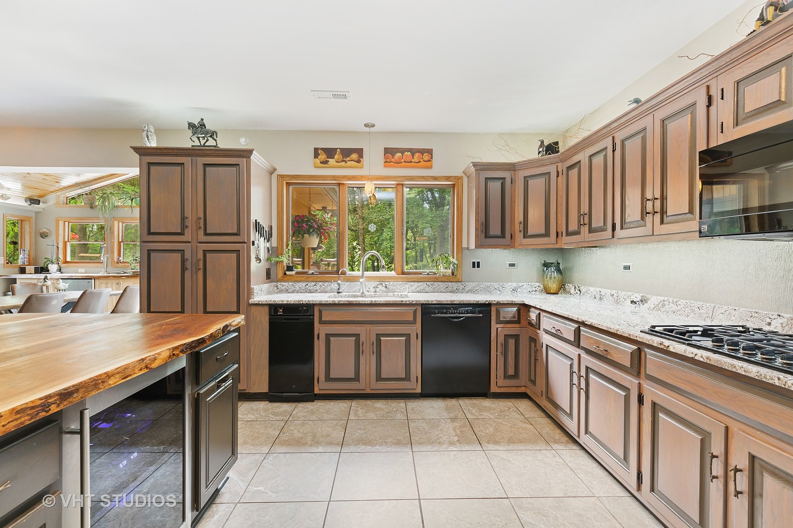 9N483 Muirhead Road Elgin, IL 60124 - Photo 18 of 40 a kitchen with stainless steel appliances granite countertop a stove sink and cabinets