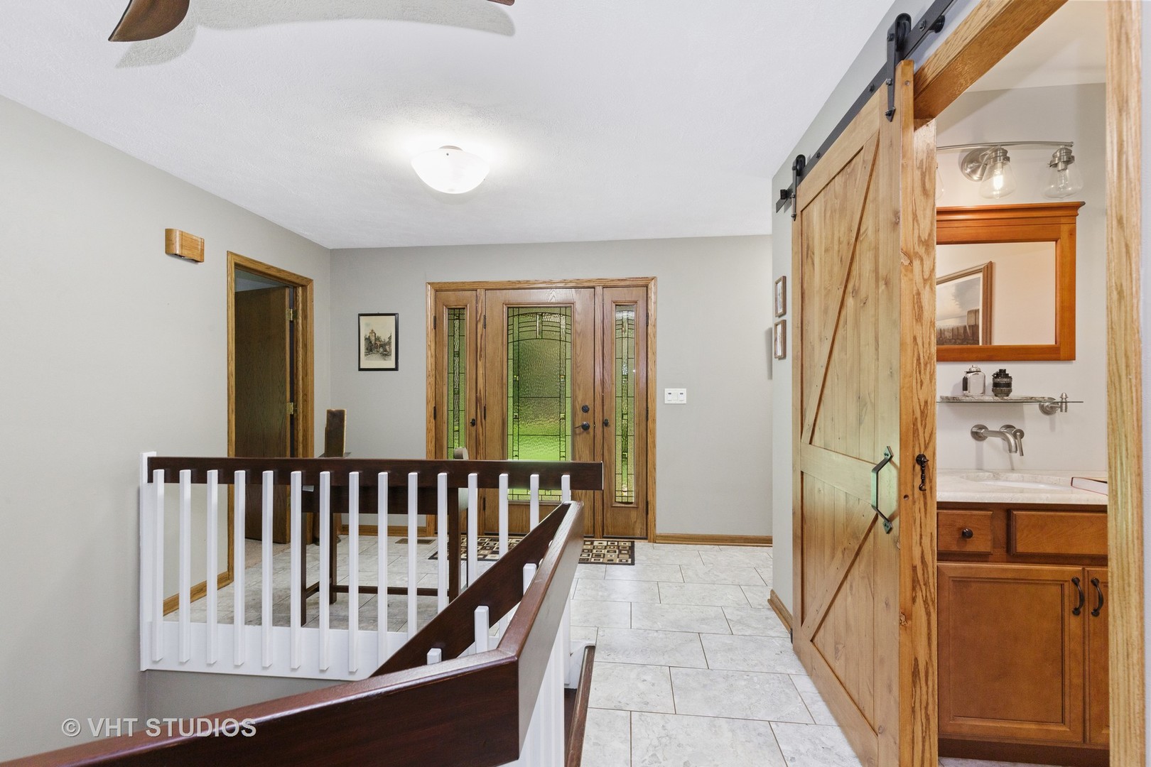 9N483 Muirhead Road Elgin, IL 60124 - Photo 4 of 40 a view of a hallway with wooden floor and staircase
