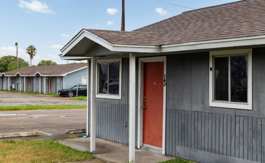 1010 Behmann Street Corpus Christi, TX 78418 - Photo 3 of 10 a view of a house with a porch and a yard