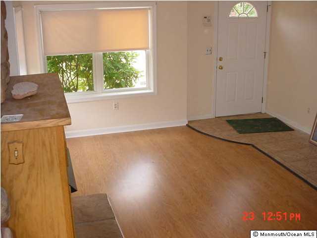131 Mantoloking Road Brick, NJ 08723 - Photo 2 of 3 a view of a storage & utility room with a window