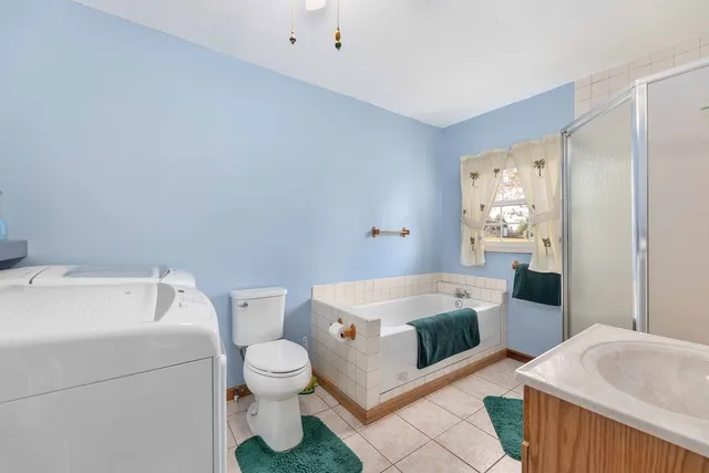 a view of a house with backyard porch and sitting area