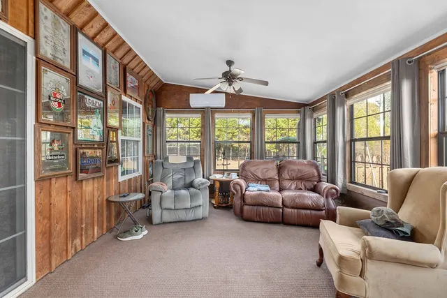 a view of a lake with houses in the back